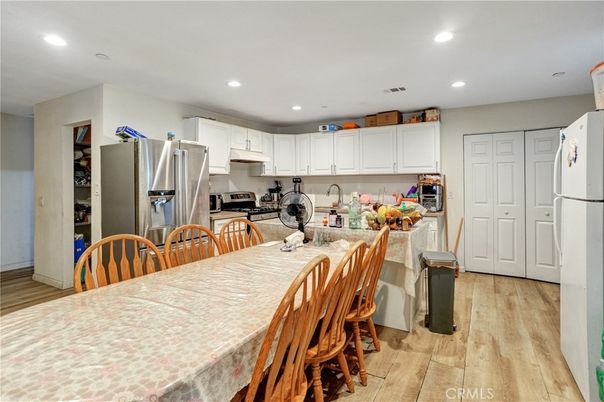 Dining room, Interior, Kitchen, Recessed Lighting, Stainless Steel Appliances, Wood Texture Flooring