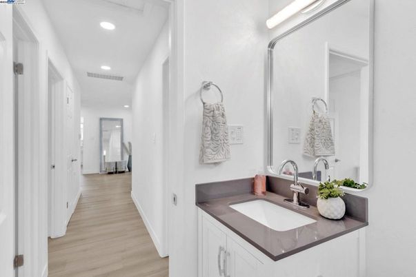 Bathroom, Dual Sink Vanities, Interior, Recessed Lighting, Wood Texture Flooring