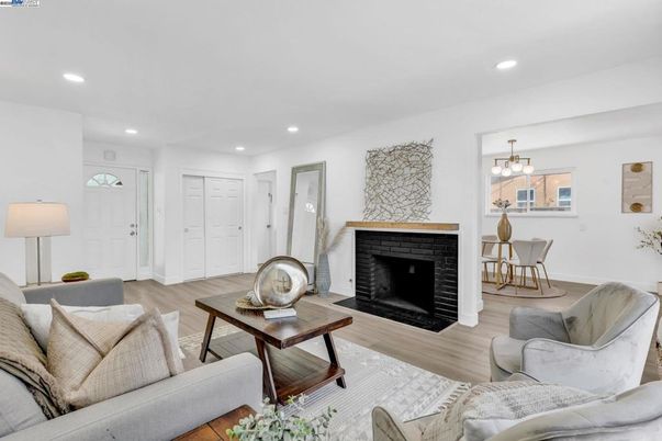 Chandelier, Dining room, Fireplace, Interior, Living room, Recessed Lighting, Wood Texture Flooring
