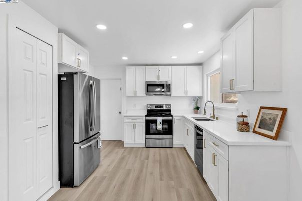 Interior, Kitchen, Recessed Lighting, Stainless Steel Appliances, Wood Texture Flooring