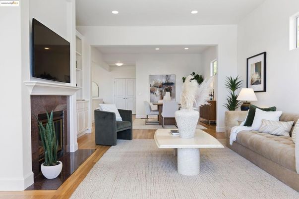 Dining room, Fireplace, Interior, Living room, Recessed Lighting, Wood Texture Flooring
