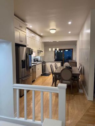Dining room, Interior, Kitchen, Pendant Lights, Recessed Lighting, Stainless Steel Appliances, Wood Texture Flooring