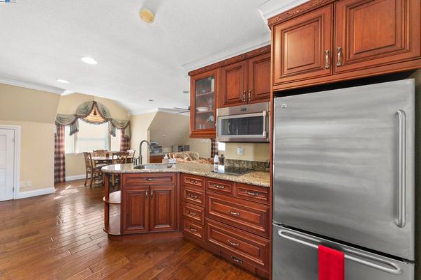 Dining room, Interior, Kitchen, Recessed Lighting, Stainless Steel Appliances, Wood Texture Flooring