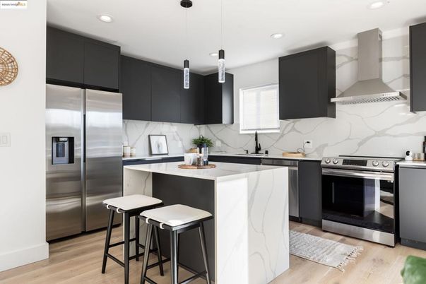 Interior, Kitchen, Marble Walls, Pendant Lights, Recessed Lighting, Stainless Steel Appliances, Wood Texture Flooring