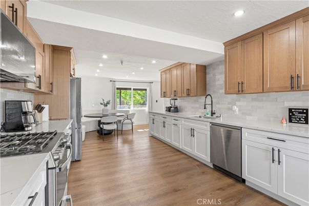 Dining room, Interior, Kitchen, Recessed Lighting, Stainless Steel Appliances, Wood Texture Flooring