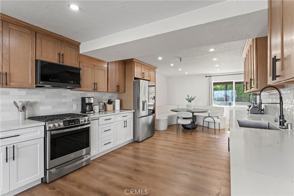 Dining room, Interior, Kitchen, Recessed Lighting, Stainless Steel Appliances, Wood Texture Flooring