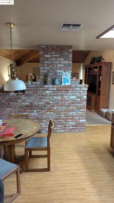 Dining room, Fireplace, Interior, Pendant Lights, Stone Walls, Wood Texture Flooring