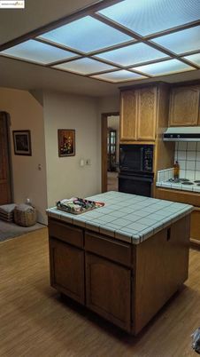 Interior, Kitchen, Tile Countertops, Wood Texture Flooring