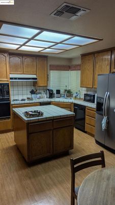 Interior, Kitchen, Tile Countertops, Wood Texture Flooring