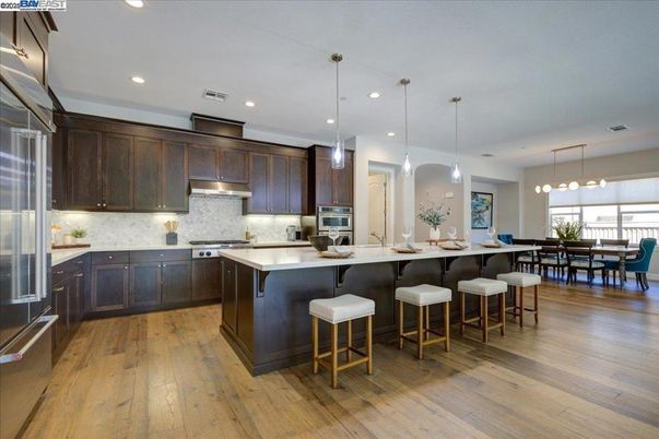 Dining room, Interior, Kitchen, Pendant Lights, Recessed Lighting, Stainless Steel Appliances, Wood Texture Flooring
