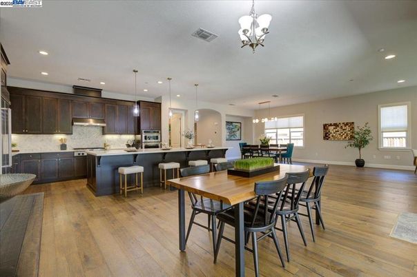 Chandelier, Dining room, Interior, Kitchen, Pendant Lights, Recessed Lighting, Stainless Steel Appliances, Wood Texture Flooring