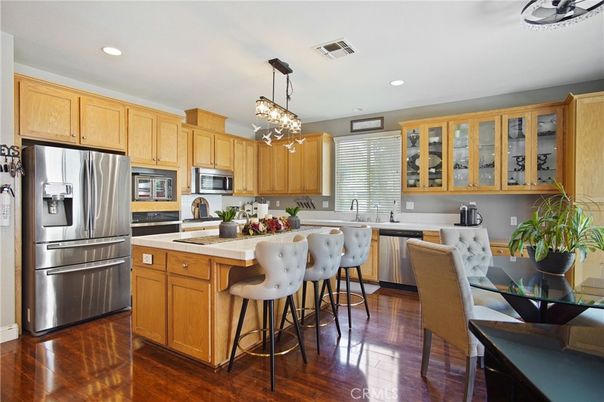 Dining room, Interior, Kitchen, Pendant Lights, Recessed Lighting, Stainless Steel Appliances, Wood Texture Flooring