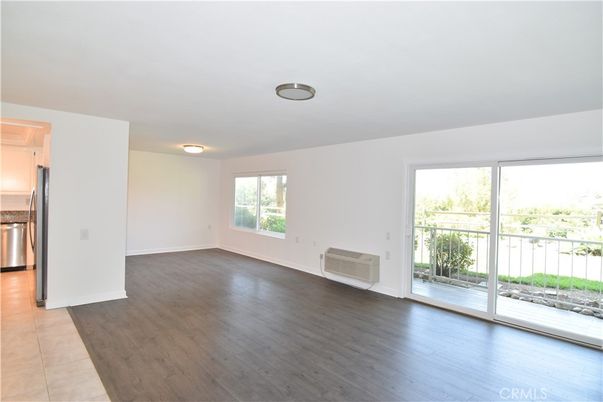 Empty room, Interior, Kitchen, Stainless Steel Appliances, Wood Texture Flooring