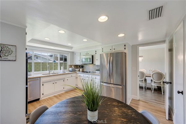 Dining room, Interior, Kitchen, Recessed Lighting, Stainless Steel Appliances, Wood Texture Flooring