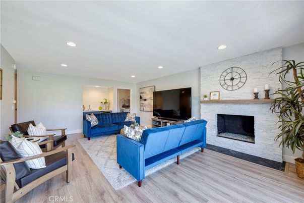 Fireplace, Interior, Living room, Recessed Lighting, Stone Walls, Wood Texture Flooring