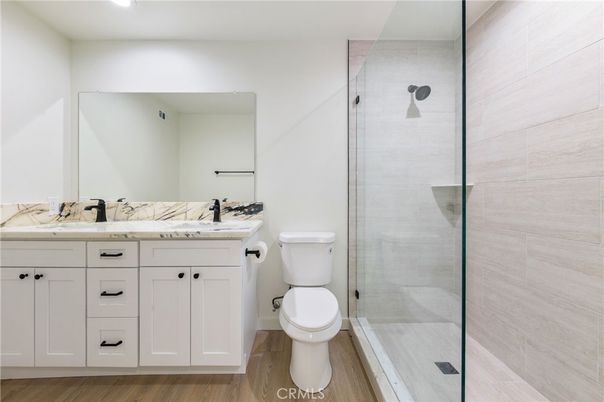 Bathroom, Dual Sink Vanities, Glass Shower, Interior, Wood Texture Flooring