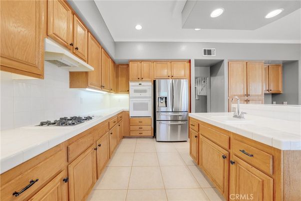 Interior, Kitchen, Recessed Lighting, Stainless Steel Appliances, Tile Countertops