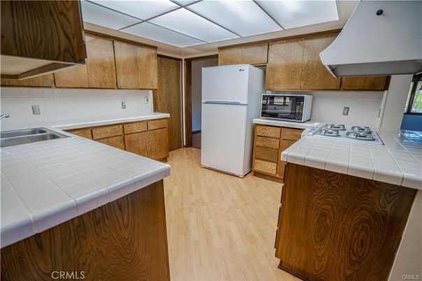 Interior, Kitchen, Tile Countertops, Wood Texture Flooring