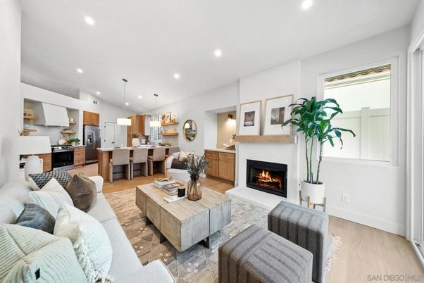Fireplace, Interior, Kitchen, Living room, Pendant Lights, Recessed Lighting, Stainless Steel Appliances, Wood Texture Flooring