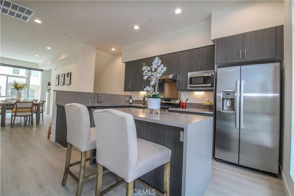 Dining room, Interior, Kitchen, Recessed Lighting, Stainless Steel Appliances, Wood Texture Flooring