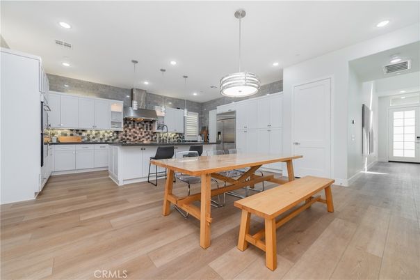 Dining room, Interior, Kitchen, Pendant Lights, Recessed Lighting, Stainless Steel Appliances, Wood Texture Flooring