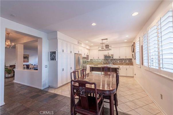 Chandelier, Dining room, Interior, Kitchen, Pendant Lights, Recessed Lighting, Stainless Steel Appliances