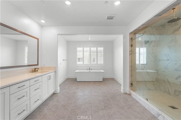 Bathroom, Dual Sink Vanities, Free Standing Baths, Glass Shower, Interior, Marble Walls, Recessed Lighting