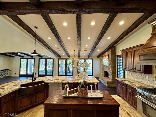 Chandelier, Interior, Kitchen, Pendant Lights, Recessed Lighting, Stainless Steel Appliances, Stone Walls, Wooden Beams