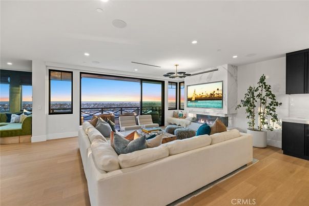 Fireplace, Interior, Living room, Marble Walls, Recessed Lighting, Water, Wood Texture Flooring