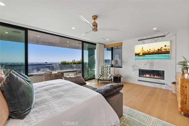 Bedroom, Fireplace, Interior, Recessed Lighting, Water, Wood Texture Flooring