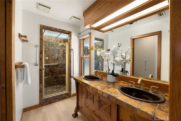Bathroom, Dual Sink Vanities, Glass Shower, Interior, Tile Countertops, Wood Texture Flooring