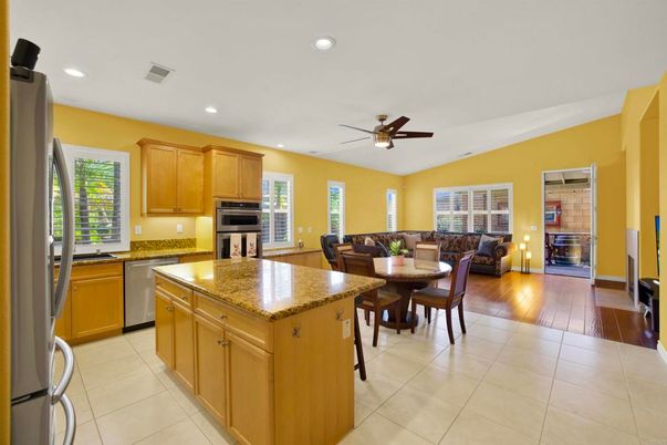 Dining room, Fireplace, Interior, Kitchen, Living room, Recessed Lighting, Stainless Steel Appliances, Wood Texture Flooring