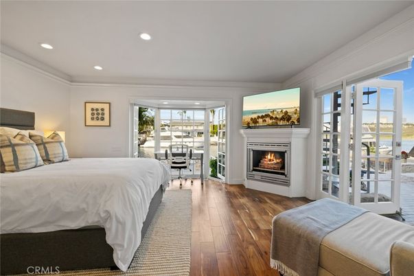 Bedroom, Fireplace, Interior, Recessed Lighting, Water, Wood Texture Flooring
