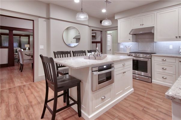 Dining room, Interior, Kitchen, Pendant Lights, Recessed Lighting, Stainless Steel Appliances, Wood Texture Flooring
