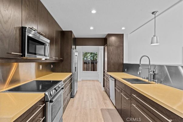 Interior, Kitchen, Pendant Lights, Recessed Lighting, Stainless Steel Appliances, Wood Texture Flooring