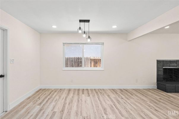 Empty room, Fireplace, Interior, Pendant Lights, Recessed Lighting, Wood Texture Flooring