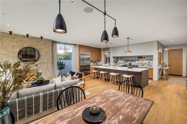 Dining room, Interior, Kitchen, Living room, Pendant Lights, Recessed Lighting, Stainless Steel Appliances, Stone Walls, Wood Texture Flooring