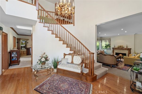 Chandelier, Fireplace, Interior, Living room, Recessed Lighting, Wood Texture Flooring