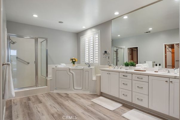 Bathroom, Dual Sink Vanities, Glass Shower, Interior, Recessed Lighting, Wood Texture Flooring