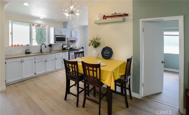 Dining room, Interior, Kitchen, Pendant Lights, Recessed Lighting, Stainless Steel Appliances, Wood Texture Flooring