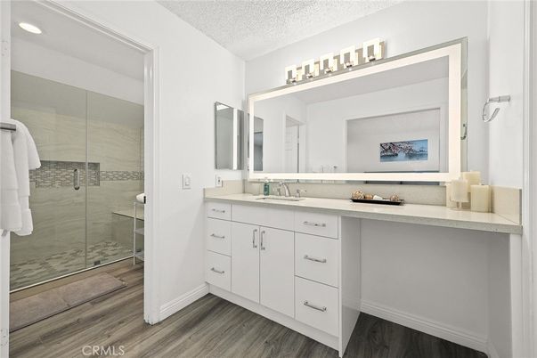Bathroom, Dual Sink Vanities, Glass Shower, Interior, Recessed Lighting, Wood Texture Flooring