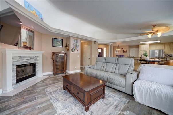 Fireplace, Interior, Kitchen, Living room, Pendant Lights, Recessed Lighting, Stainless Steel Appliances, Wood Texture Flooring