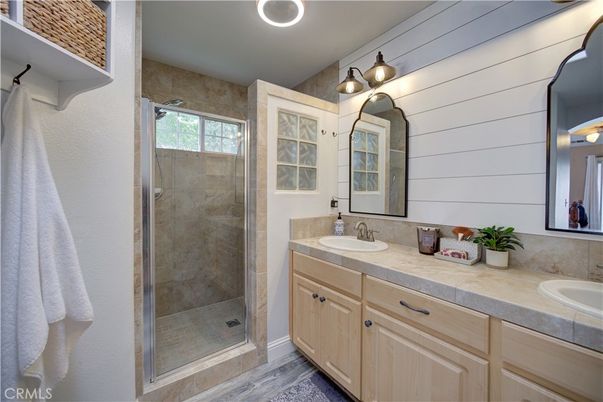 Bathroom, Dual Sink Vanities, Glass Shower, Interior, Tile Countertops, Wood Texture Flooring