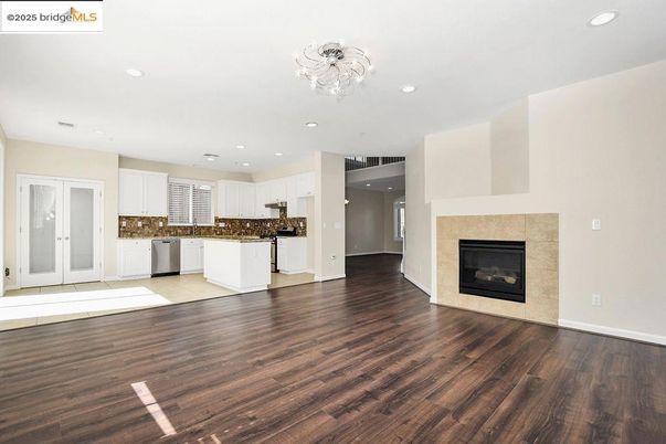 Empty room, Fireplace, Interior, Kitchen, Recessed Lighting, Wood Texture Flooring