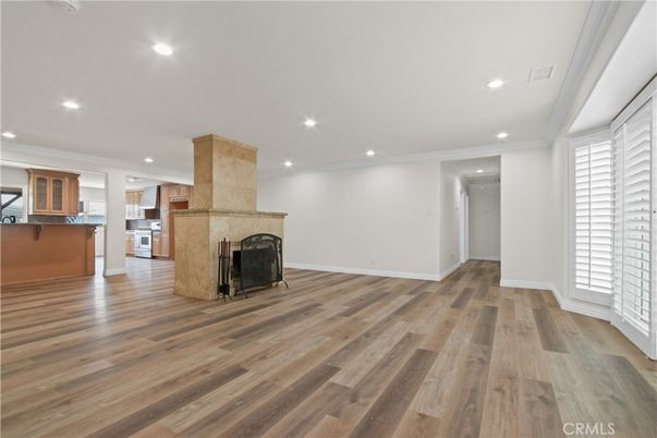 Empty room, Fireplace, Interior, Kitchen, Recessed Lighting, Wood Texture Flooring