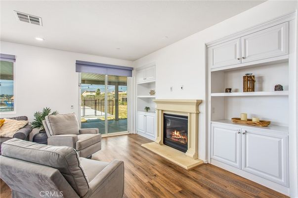 Fireplace, Interior, Living room, Recessed Lighting, Water, Wood Texture Flooring
