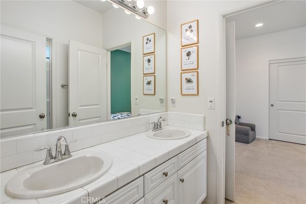 Bathroom, Dual Sink Vanities, Interior, Recessed Lighting, Tile Countertops