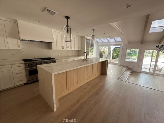 Interior, Kitchen, Marble Walls, Pendant Lights, Recessed Lighting, Stainless Steel Appliances, Wood Texture Flooring
