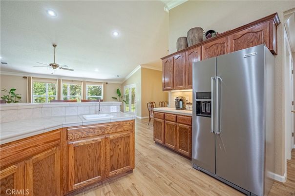 Interior, Kitchen, Recessed Lighting, Tile Countertops, Wood Texture Flooring