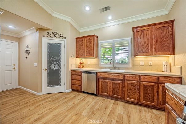 Interior, Kitchen, Recessed Lighting, Tile Countertops, Wood Texture Flooring